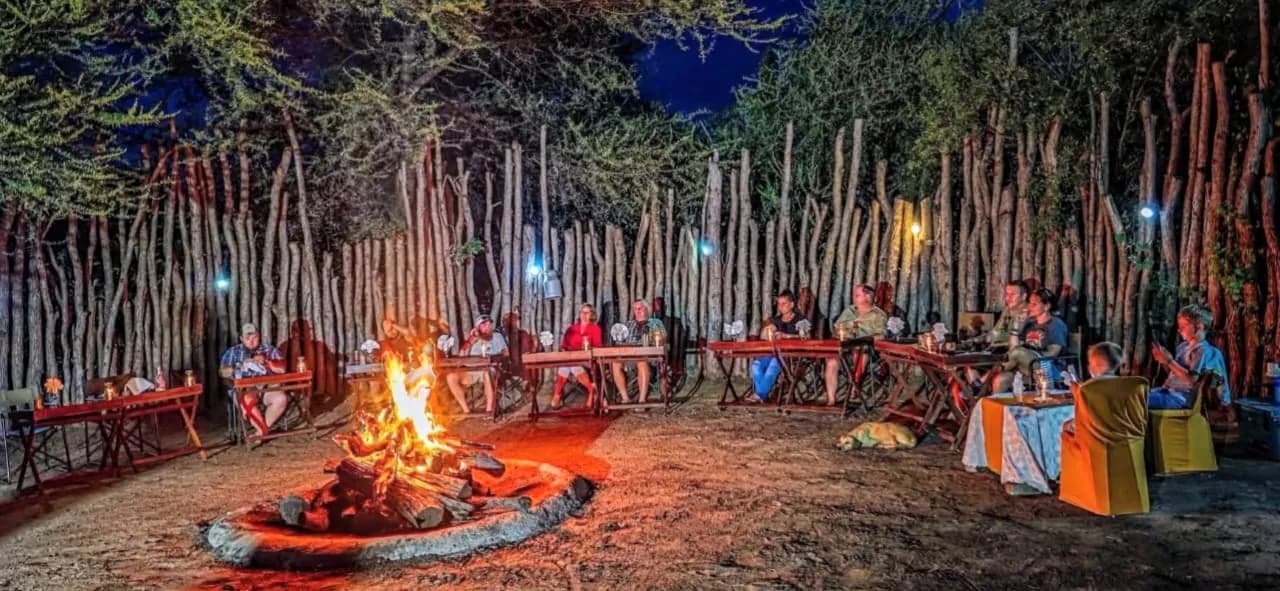 Evening around the boma fire inside the pole fence