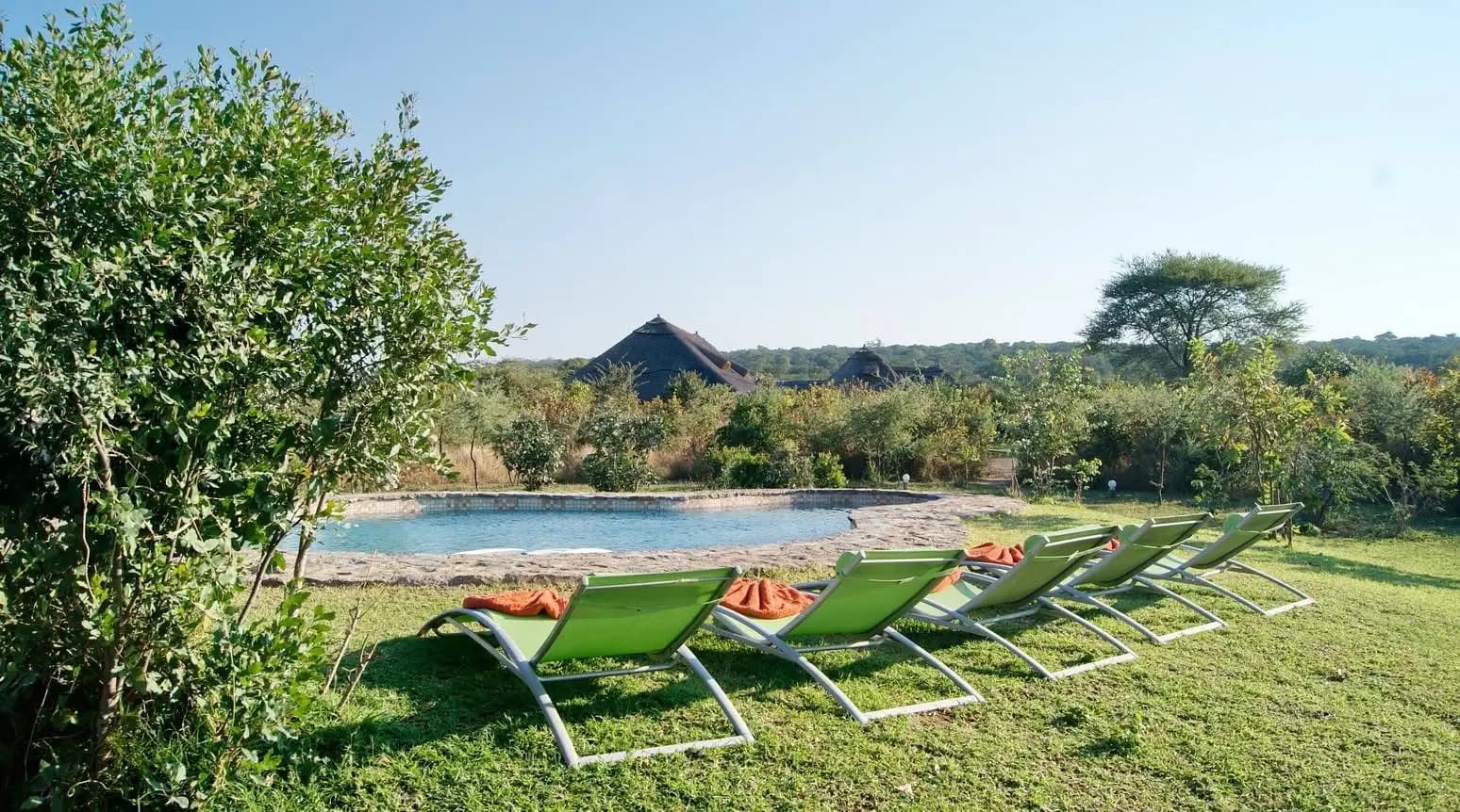 Pool and sun loungers in the lodge garden
