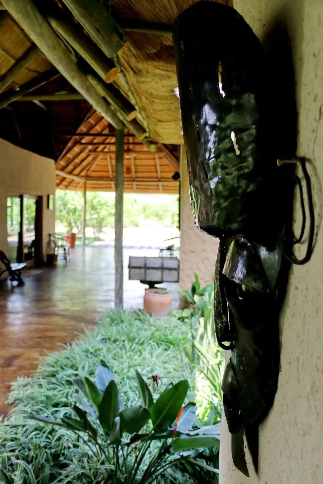 Thatched walkway with a metal mask